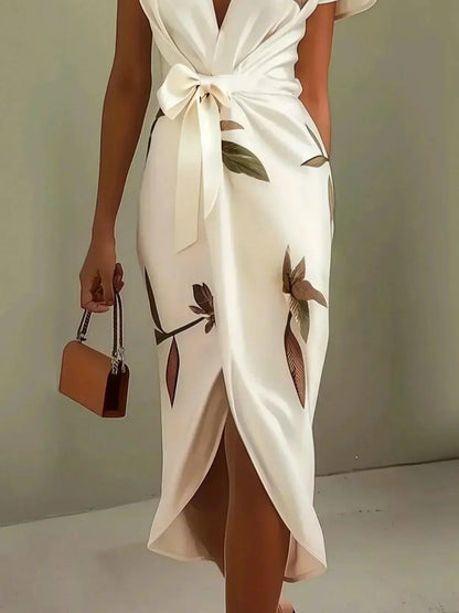 Evie - Elegant blommig omlottklänning