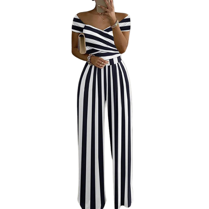 CHYNA™ – Blommig jumpsuit med bara axlar och omlott