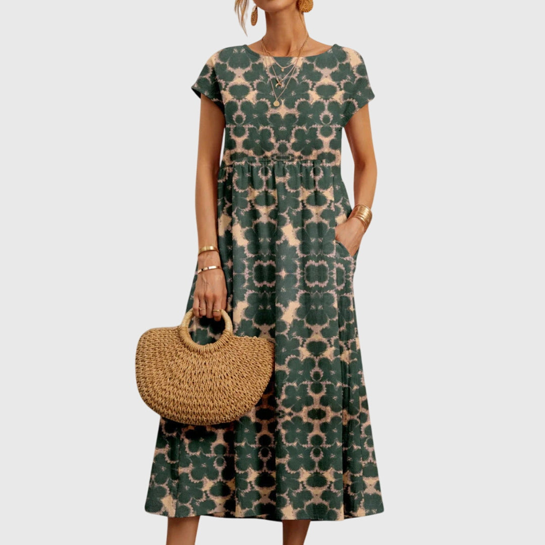 Elsie - Elegant, böljande blommig klänning