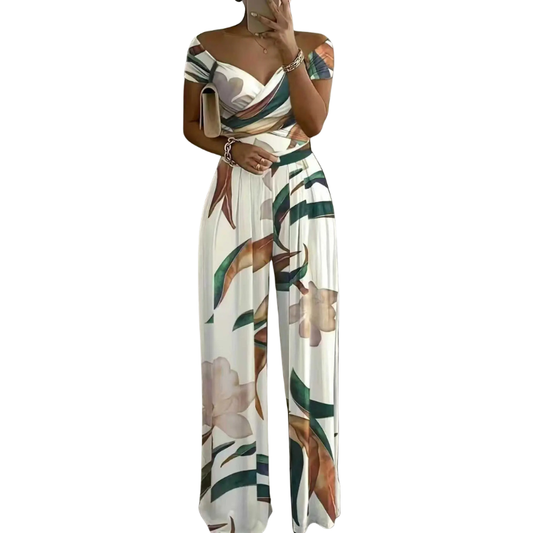CHYNA™ – Blommig jumpsuit med bara axlar och omlott